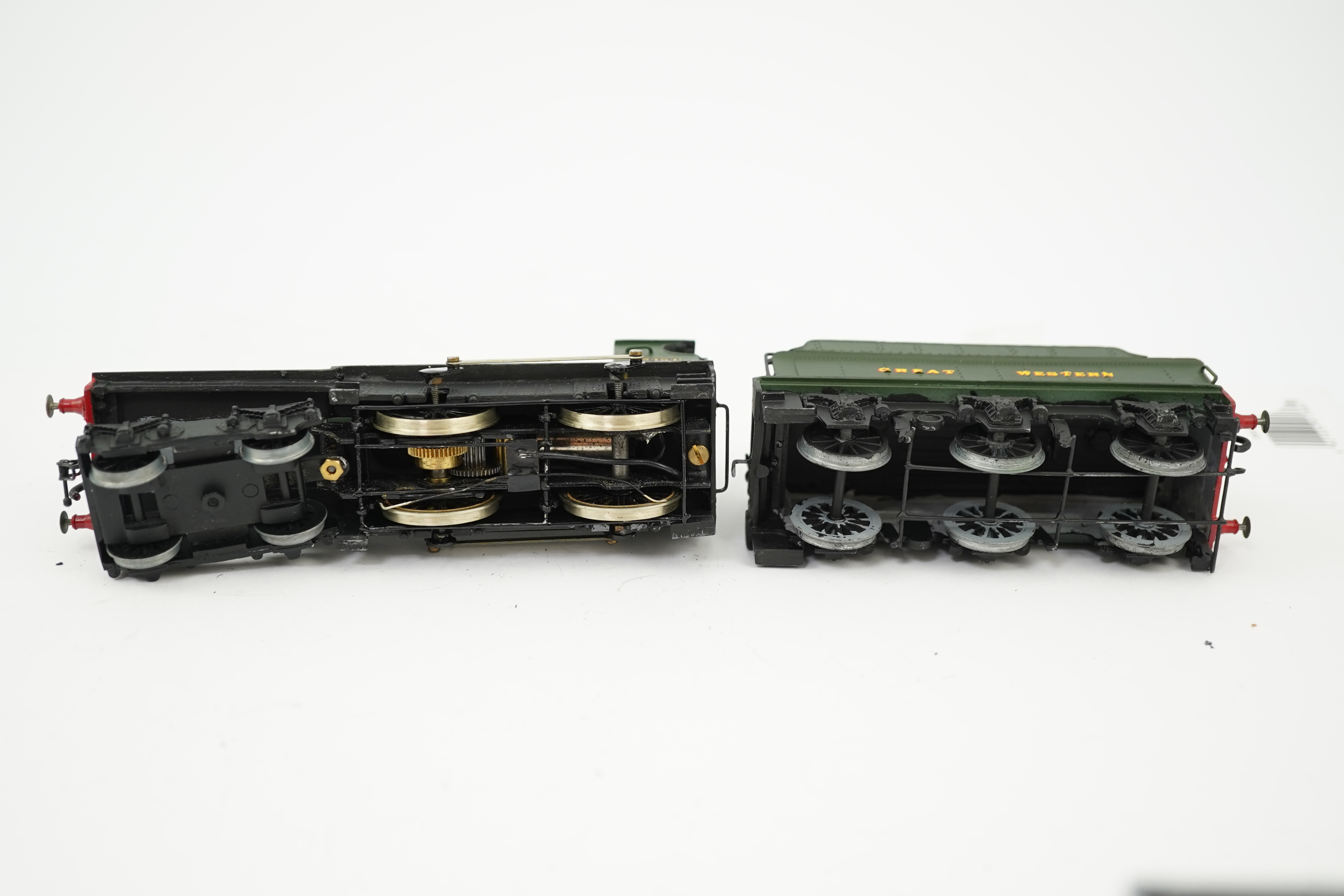Three 00 gauge brass and white metal kit built GWR tender locomotives; a 2884 class 2-8-0, 2884, together with an 33xx class 4-4-0, 3454, and a War Dept. 2-8-0, 3012, all constructed, painted and lined to a high standard